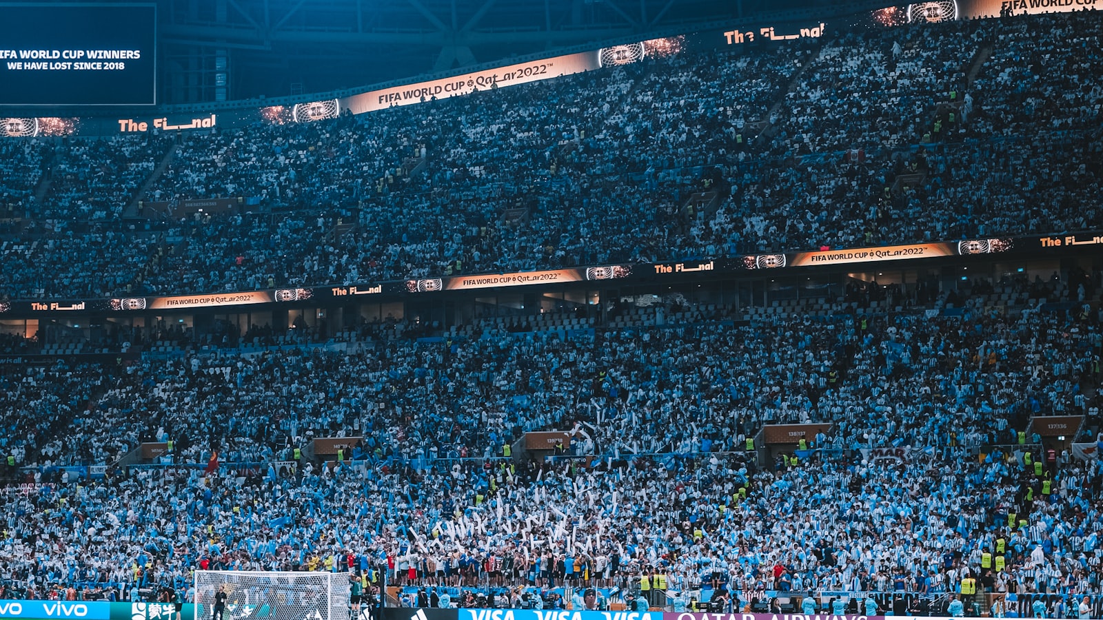 A packed stadium crowd watching a match