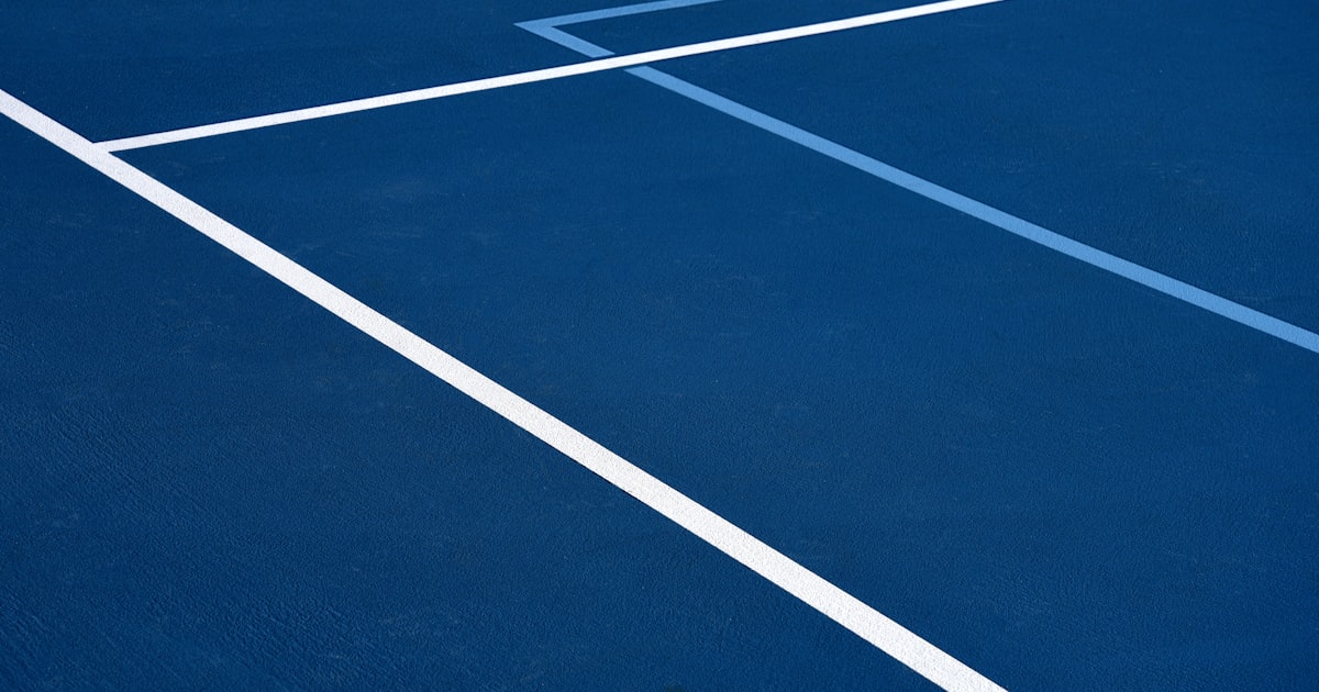 Blue and white outdoor pickleball court surface