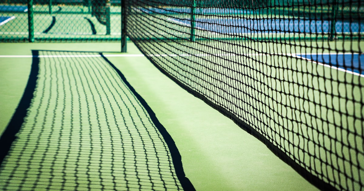 Black and white close-up of a pickleball net